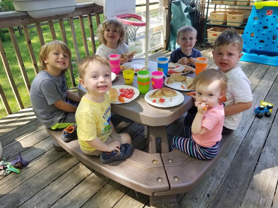 Children eat lunch at Emily Rodenbeck's former day care, which she ran out of her home until 2019.