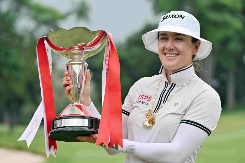 Australian golfer Hannah Green holds up the HSBC Women's World Championship trophy after her victory at Sentosa Golf Club. (PHOTO: HSBC Women's World Championship)