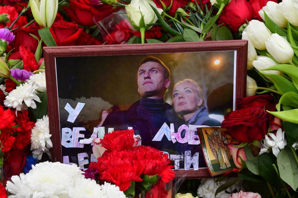 A photograph of Alexei and Yulia Navalny is seen on the grave of Russian opposition leader Alexei Navalny at the Borisovo cemetery in Moscow on March 2, 2024.<span class="copyright">Olga Maltseva—AFP/Getty Images</span>