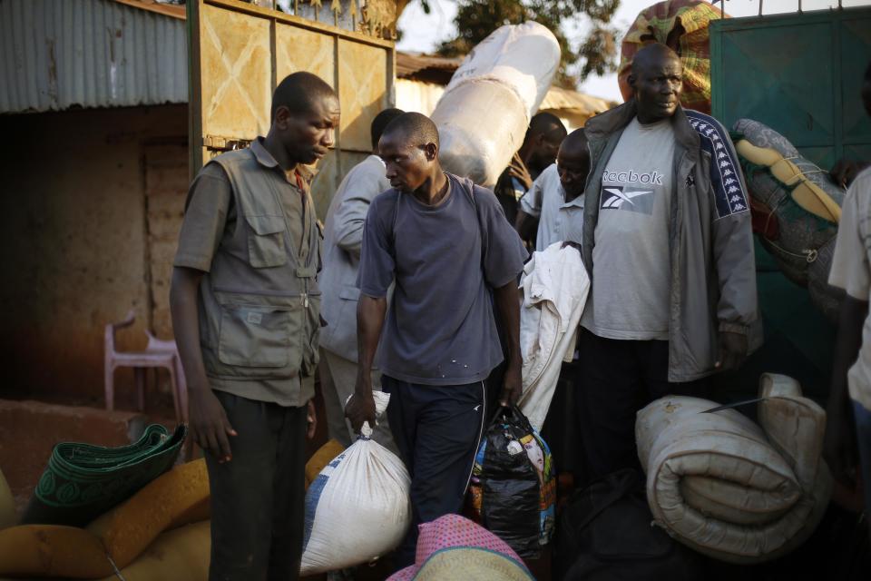 Seleka militiamen are evacuated by Burundi troops from their Miskin district compound in Bangui, Central African Republic, Wednesday Jan. 29, 2014, after a grenade was thrown at their gate by unknown assailants. Fighting between rival Muslim Seleka factions and Christian anti_Balaka militias continues, as two Muslim men were slaughtered by unknown assailants with machetes nearby, prompting French forces to fire warning shots in the air but not intervene to try to prevent the killings. (AP Photo/Jerome Delay)