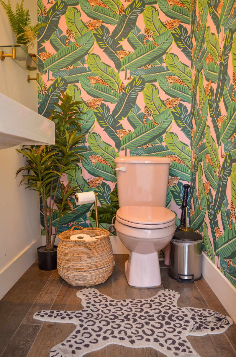 Palm motif wallpaper in bathroom.