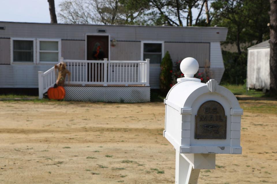 A white mailbox sits in front of a home in Ewell on Smith Island on Oct. 9, 2020. Residents are fighting to get the island's last remaining voting precinct reopened after officials closed it. Residents do have the choice to vote by mail, but many don't trust the option and prefer to vote in person.