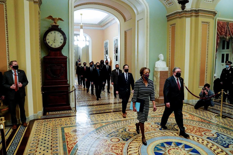 US House Clerk Cheryl Johnson, Representative Jamie Raskin (D-MD) and Representative David Cicilline (D-RI) walk  walk through the Capitols Statuary Hall to deliver the article of impeachment for incitement of insurrection against former President Donald Trump to the Senate floor on January 25, 2021 in Washington, DC. (Photo by Melina Mara / POOL / AFP) (Photo by MELINA MARA/POOL/AFP via Getty Images) ORG XMIT: 0 ORIG FILE ID: AFP_8ZJ46E.jpg