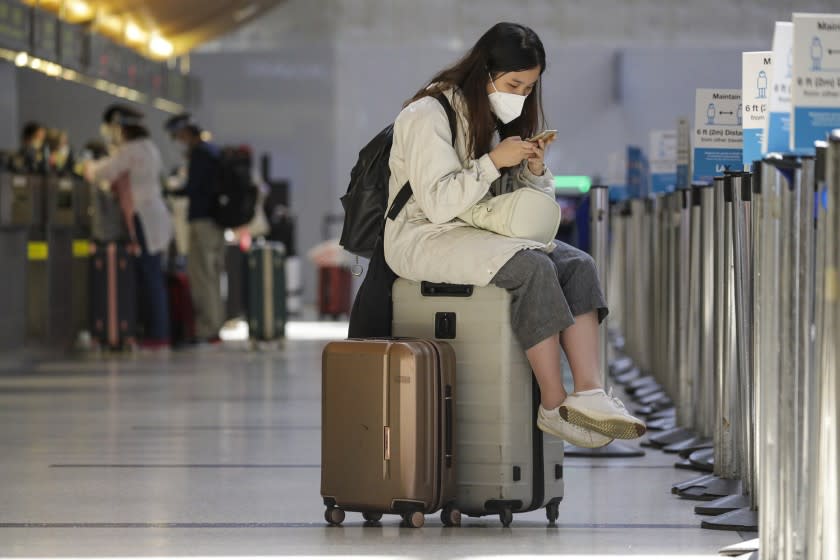 LOS ANGELES, CA - MAY 22: Due to global pandemic and upcoming Memorial Day Weekend travelers are strongly advised to follow mask and social distancing recommendations at Los Angeles International Airport. Los Angeles Airport LAX on Friday, May 22, 2020 in Los Angeles, CA. (Irfan Khan / Los Angeles Times)