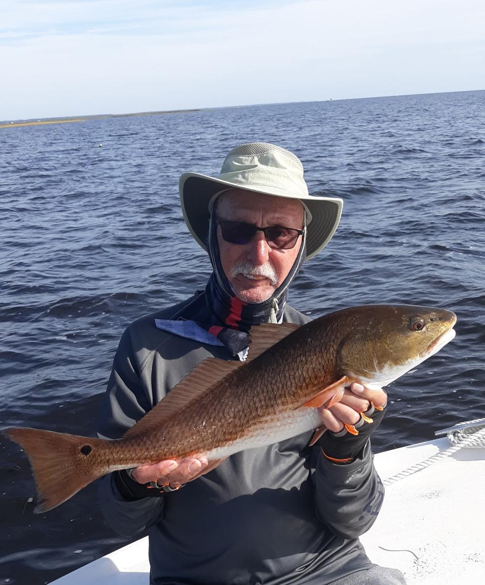 Steven Cook of Woodstock, Georgia, with the largest red of the nine keepers caught.