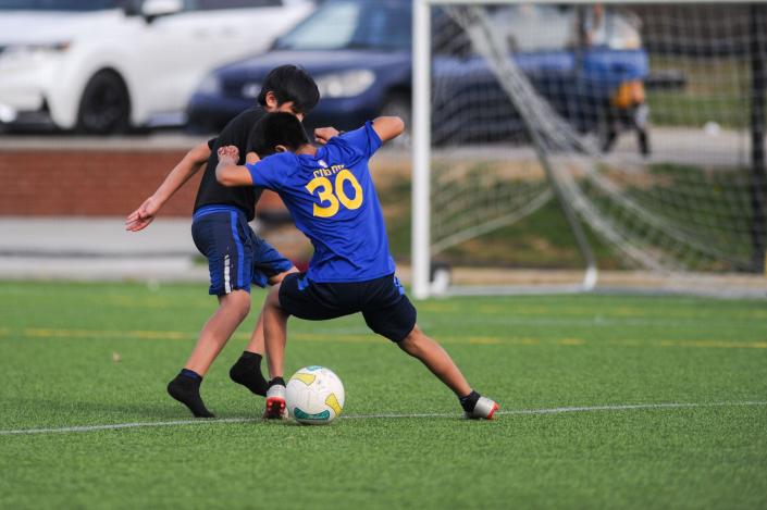 Kids play pickup soccer at the Emerald Youth Sports Complex in Lonsdale, Tenn. on Monday, March 21, 2022.