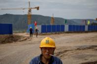 The Wider Image: Energy security and economic fears drive China's return to coal