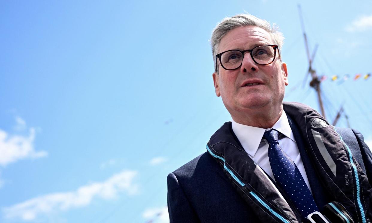 <span>Keir Starmer, who was visiting the historic dockyards at Portsmouth, said the prime minister ‘lied about our plans’.</span><span>Photograph: Dylan Martinez/Reuters</span>