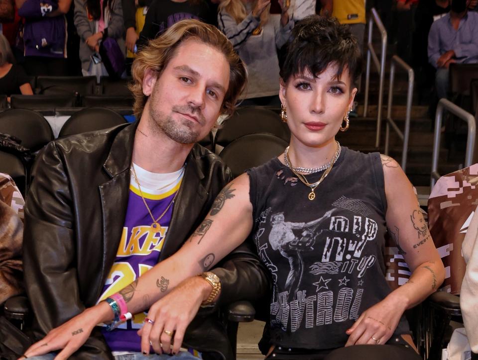 A closeup of Halsey and Alev at an event at a basketball game