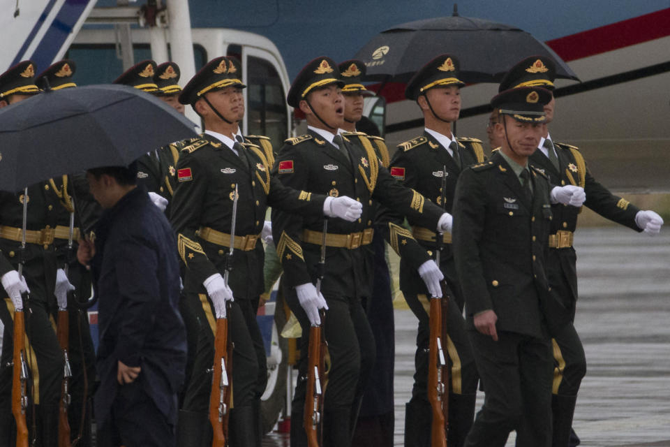 Chinese honor guards march away after welcoming Indonesian Vice President Jusuf Kalla at the special plane terminal of the Beijing International airport ahead of the Belt and Road Forum held in Beijing on Wednesday, April 24, 2019. (AP Photo/Ng Han Guan, Pool)