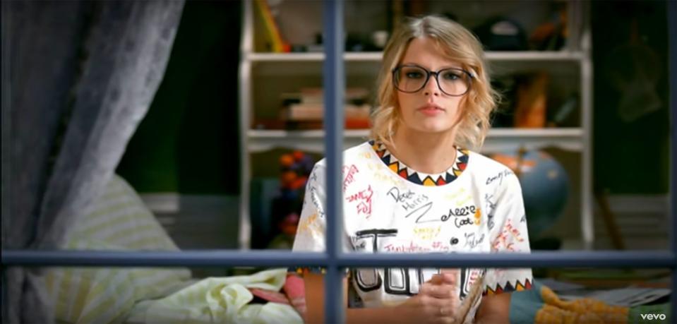 Nine years after the release of the "You Belong with Me" music video, <a rel="nofollow noopener" href="https://people.com/music/taylor-swift-look-what-you-made-me-do-music-video-squad/" target="_blank" data-ylk="slk:Swift recreated her iconic Junior Jewels shirt;elm:context_link;itc:0;sec:content-canvas" class="link ">Swift recreated her iconic Junior Jewels shirt</a> in her "Look What You Made Me Do" video. The updated shirt included names of her best friends, including "Blake & Ryan," "Selena," "Gigi," "Lena" and more.