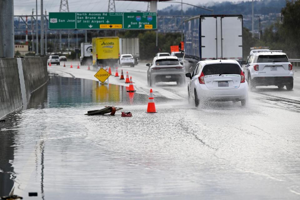 PHOTO: In this Dec. 20, 2023 file photo, the left lane is closed as cars travel on Highway 101 near San Francisco International Airport (SFO) as heavy rain batters San Francisco.  (Anadolu via Getty Images, FILE)