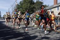 Runners compete near the start in the women's division of the 118th Boston Marathon Monday, April 21, 2014 in Hopkinton, Mass. (AP Photo/Michael Dwyer)s