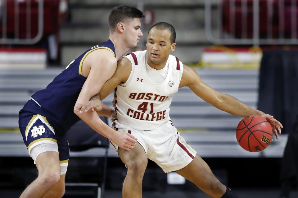 Boston College's Steffon Mitchell (41) looks to move on Notre Dame's Nate Laszewski during the first half of an NCAA college basketball game, Saturday, Feb. 27, 2021, in Boston. (AP Photo/Michael Dwyer)