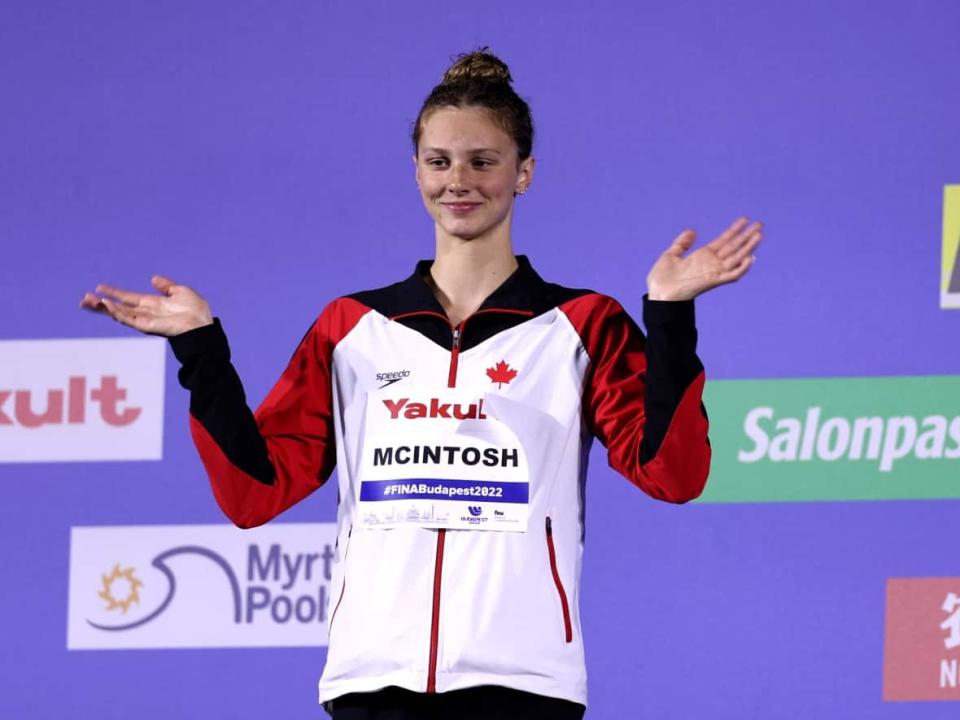 Canada's Summer McIntosh celebrates on the podium after winning gold in the women's 200-metre butterfly on Wednesday at the aquatics world championships. (Tom Pennington/Getty Images - image credit)