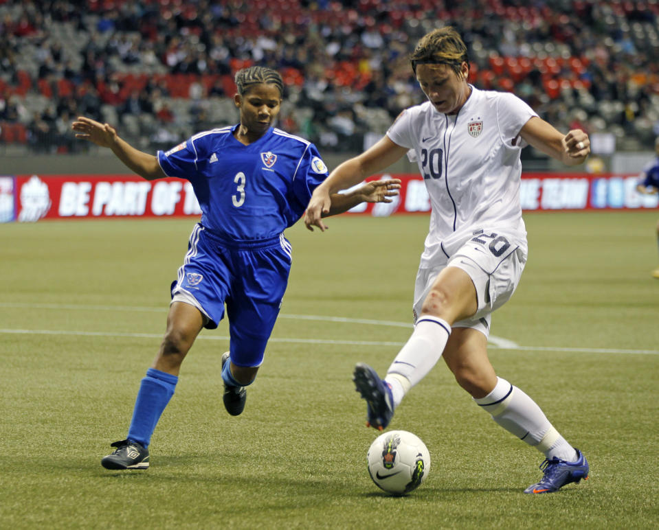 Mary Abigail Wambach #20 of the United States and Denny Vargas #3 of the Dominican Republic compete for the ball during their game at the 2012 CONCACAF Women's Olympic Qualifying Tournament at BC Place on January 20, 2012 in Vancouver, British Columbia, Canada. (Photo by Jeff Vinnick/Getty Images)