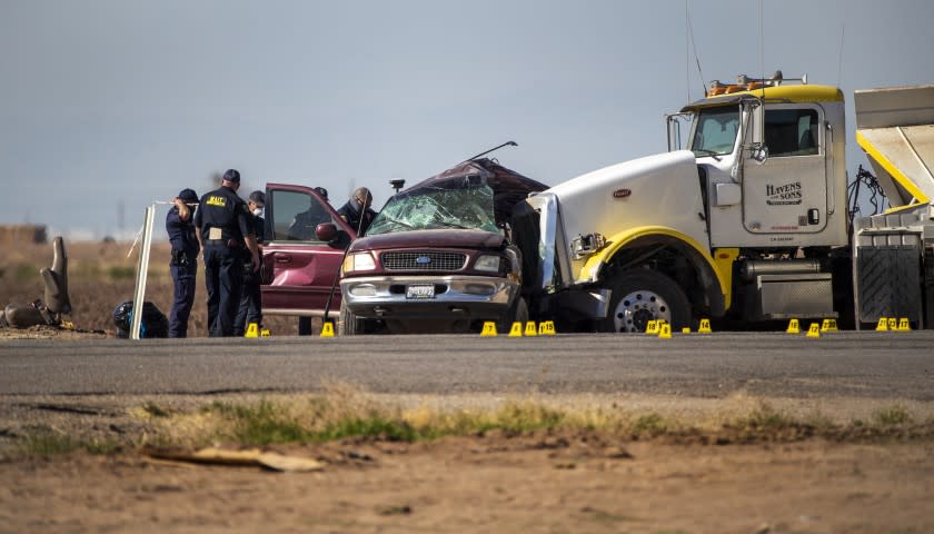 HOLTVILLE, CA - MARCH 2, 2021: CHP MAIT investigate the scene where an SUV was carrying 25 people collided with a semi-truck killing 13 on Highway 115 near the Mexican border on March 2, 2021 in Holtville, California. All the back seats had beens stripped form the vehicle. The passengers in the SUV ranged in age form 15-53.(Gina Ferazzi / Los Angeles Times)