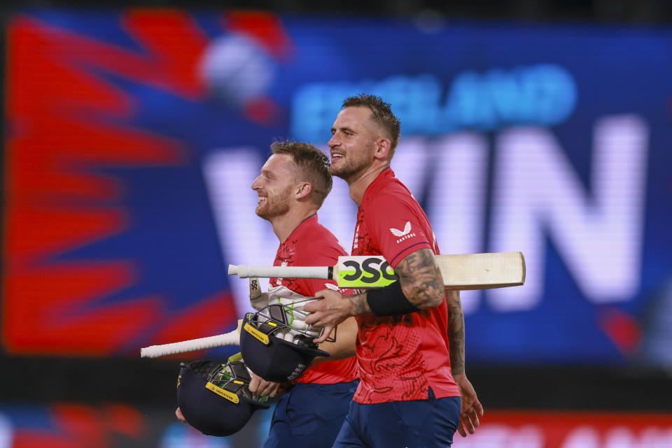 England's Jos Buttler, left, and Alex Hales walk from the field after the T20 World Cup cricket semifinal between England and India in Adelaide, Australia, Thursday, Nov. 10, 2022. England defeated India by ten wickets. (AP Photo/James Elsby)