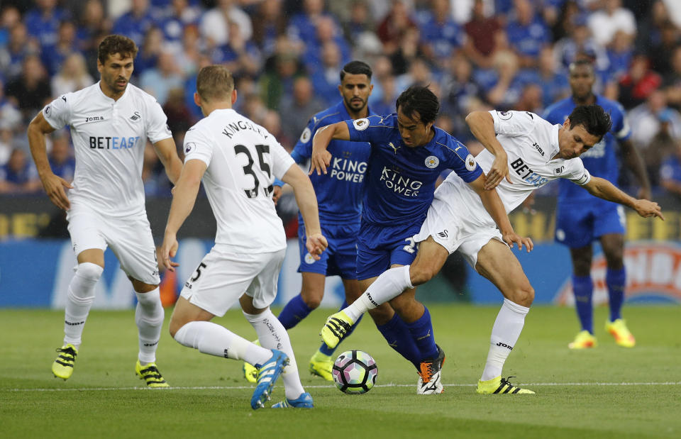 Football Soccer Britain - Leicester City v Swansea City - Premier League - King Power Stadium - 27/8/16 Leicester City's Shinji Okazaki in action with Swansea City's Jack Cork Reuters / Darren Staples Livepic EDITORIAL USE ONLY. No use with unauthorized audio, video, data, fixture lists, club/league logos or "live" services. Online in-match use limited to 45 images, no video emulation. No use in betting, games or single club/league/player publications. Please contact your account representative for further details.