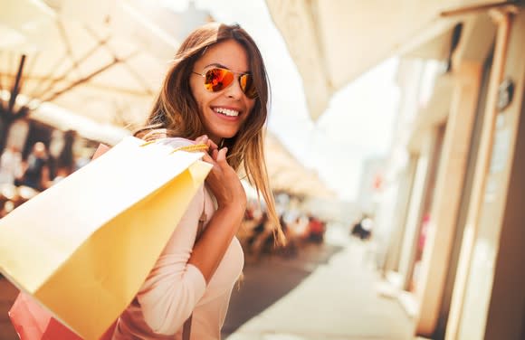 A young woman goes shopping.