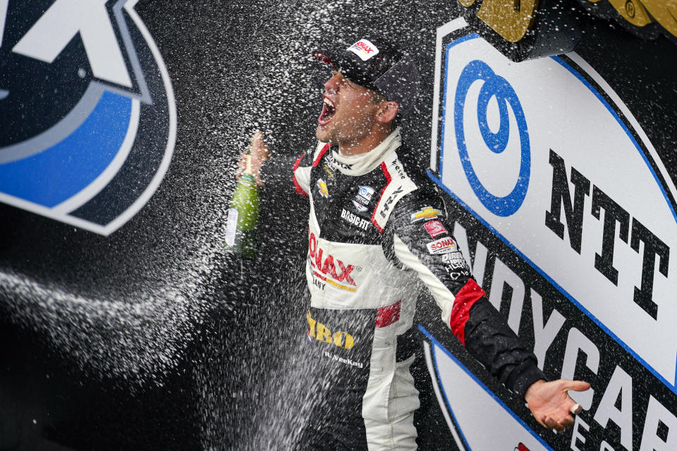 Rinus VeeKay of The Netherlands celebrates after wining the IndyCar auto race at Indianapolis Motor Speedway in Indianapolis, Saturday, May 15, 2021. (AP Photo/Michael Conroy)