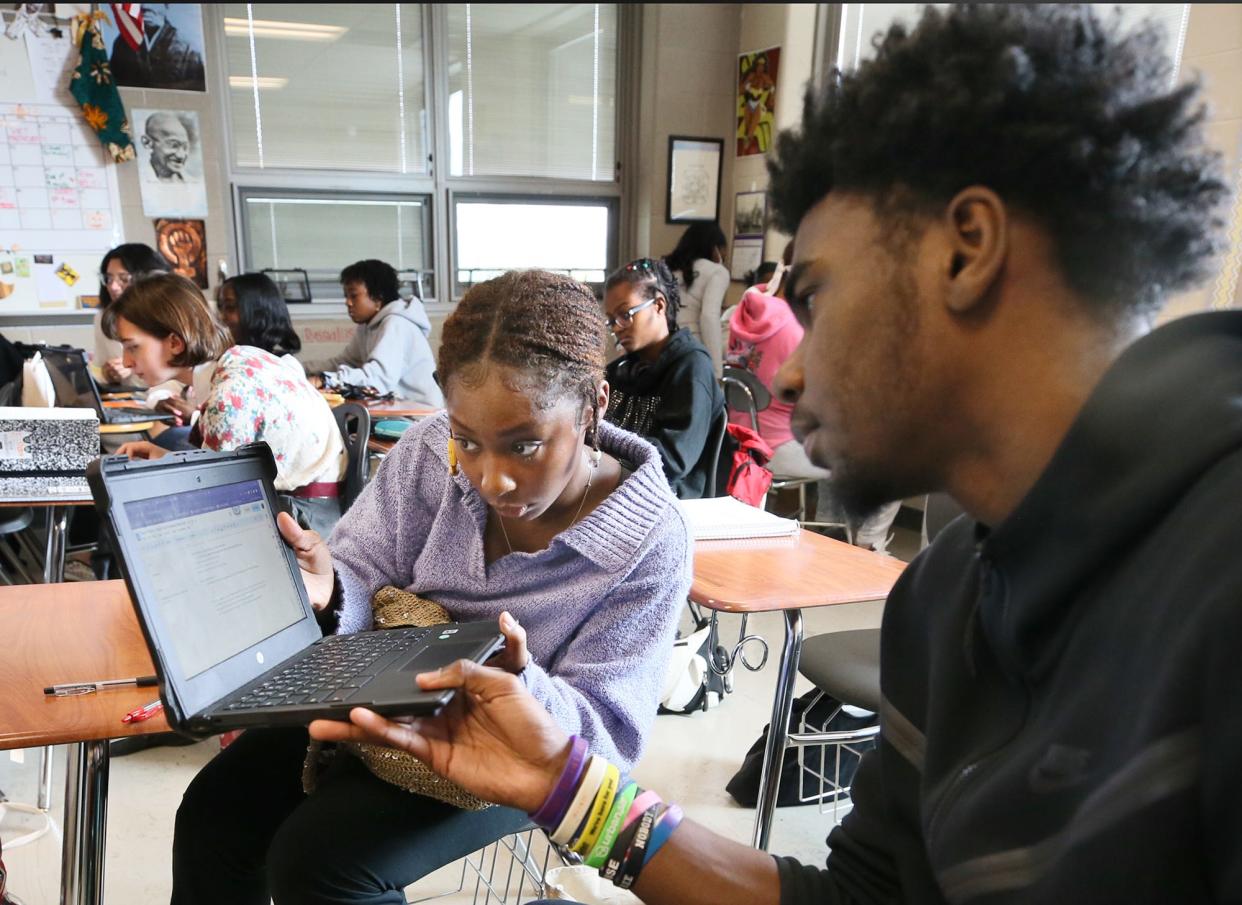 Nyjah Watson works with Johnathan White on an assignment in their AP African American Studies course at Firestone CLC.