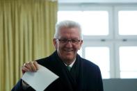 Baden-Wuerttemberg's Prime Minister and member of the environmental Greens party (Die Gruenen) Winfried Kretschmann poses with his ballot at a polling station in Sigmaringen, in the German federal state of Baden-Wuerttemberg, Germany, March 13, 2016. REUTERS/Michaela Rehle