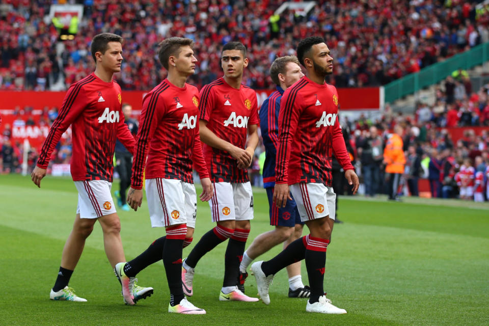 Manchester United players leave the field before the match was abandoned prior to the Barclays Premier League match between Manchester United and AFC Bournemouth at Old Trafford on May 15, 2016, in Manchester, England. (Alex Livesey/Getty Images)
