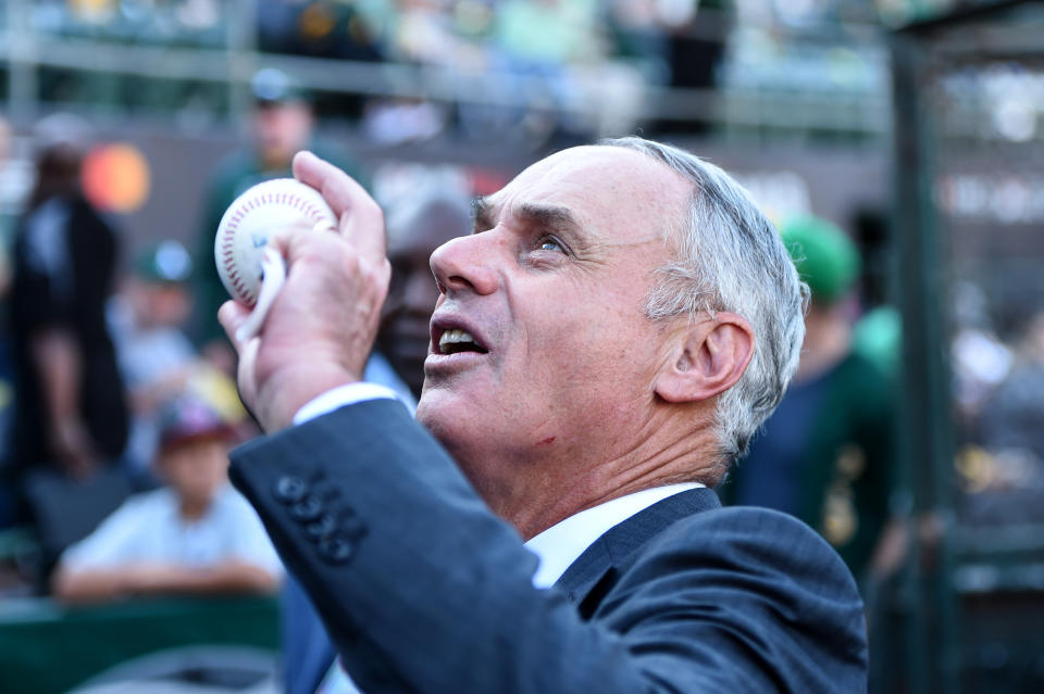 The actual baseballs themselves, one of which is being held by MLB Commissioner Rob Manfred here, have been the subject of much debate in recent months. (Photo by Cody Glenn/Icon Sportswire via Getty Images)