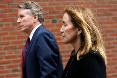 Actor Felicity Huffman arrives at the federal courthouse to face charges in a nationwide college admissions cheating scheme in Boston, Massachusetts, U.S., May 13, 2019. REUTERS/Katherine Taylor