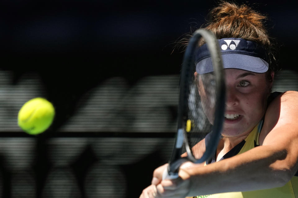 Linda Noskova of the Czech Republic plays a backhand return to Dayana Yastremska of Ukraine during their quarterfinal match at the Australian Open tennis championships at Melbourne Park, Melbourne, Australia, Wednesday, Jan. 24, 2024. (AP Photo/Louise Delmotte)