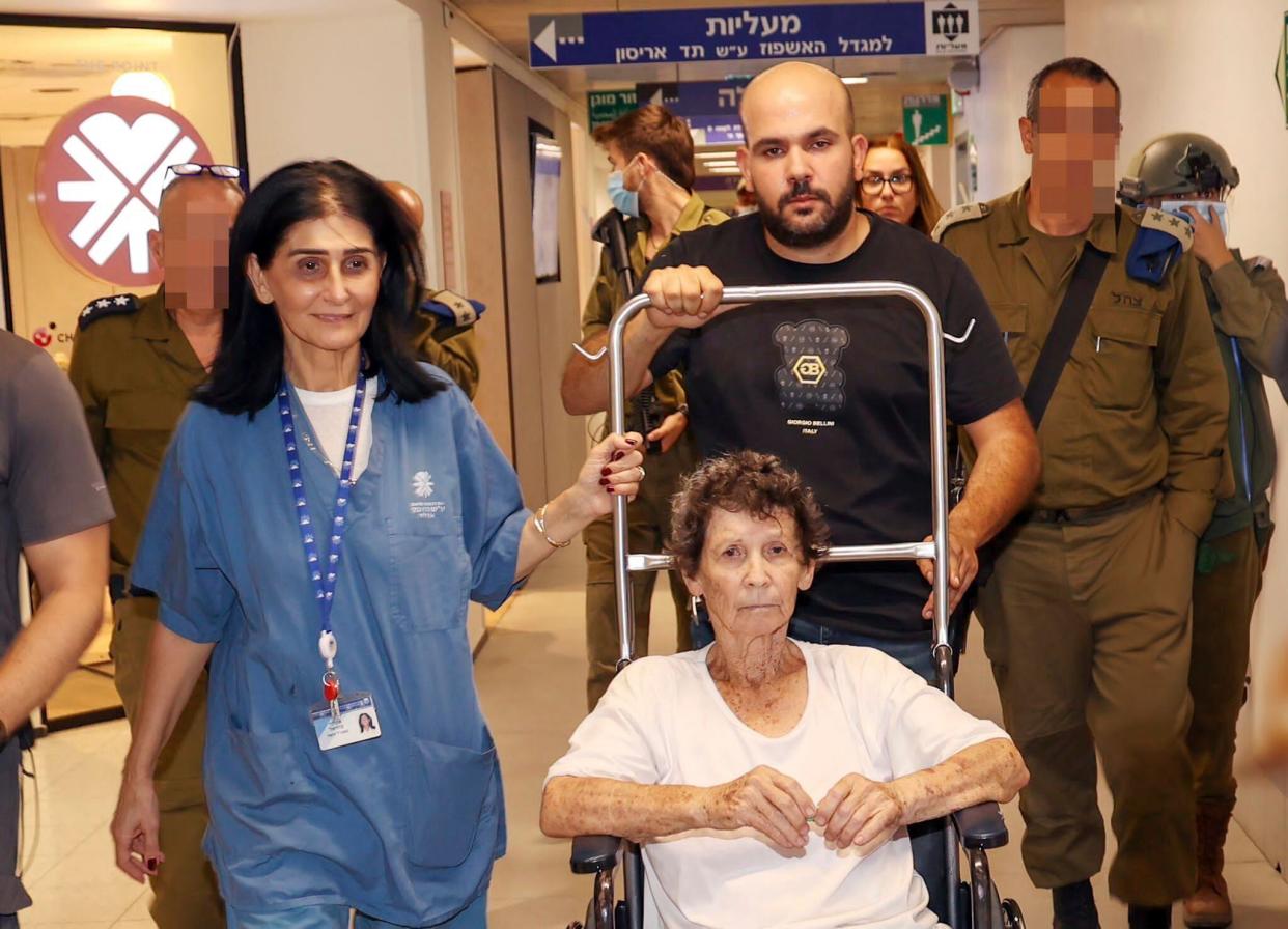 Yocheved Lifshitz being wheeled down a hallway at a hospital in Tel Aviv, Israel, after she was released by terror group Hamas (AP)