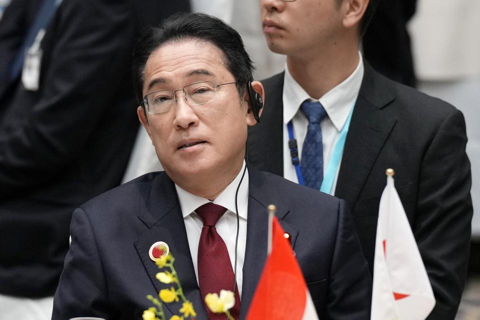 FILE - Japan's Prime Minister Fumio Kishida listens to a speaker at the 50th anniversary of the ASEAN-Japan Friendship and Cooperation luncheon meeting at KEIDANREN (Japan Business Federation) in Tokyo on Dec. 18, 2023. Japan is hosting a reconstruction conference for Ukraine on Monday, Feb. 19, 2024, just ahead of the two-year anniversary of Russia’s invasion as Tokyo seeks to showcase its commitment to supporting the war-torn country. (AP Photo/Eugene Hoshiko, Pool, File)