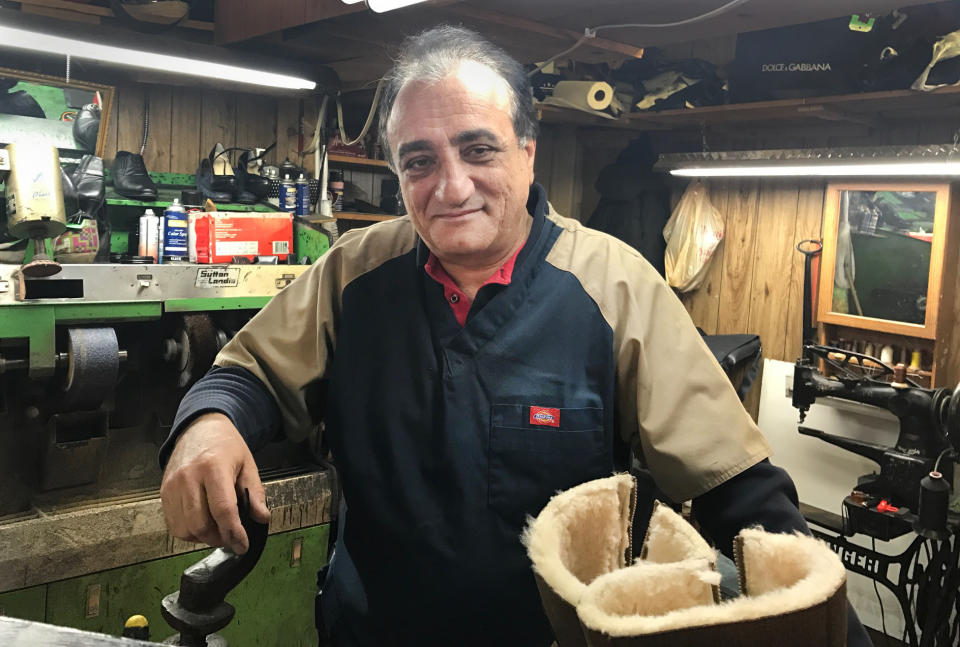 In this Dec. 15, 2016 photo, Roman Gadayev works in his Brighton Beach shoe repair shop in the Brooklyn borough of New York. Gadayev holds a firm view on allegations that Russia meddled in the U.S. presidential election. "Simply impossible," said the Kazakhstan native who voted for Donald Trump. (AP Photo/Alina Heineke)