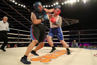 <p>Robert Marzano (red) fights Jafet Sori (blue) in the TD1 ATU Grudge Match at the NYPD Boxing Championships at the Hulu Theater at Madison Square Garden on March 15, 2018. (Gordon Donovan/Yahoo News) </p>