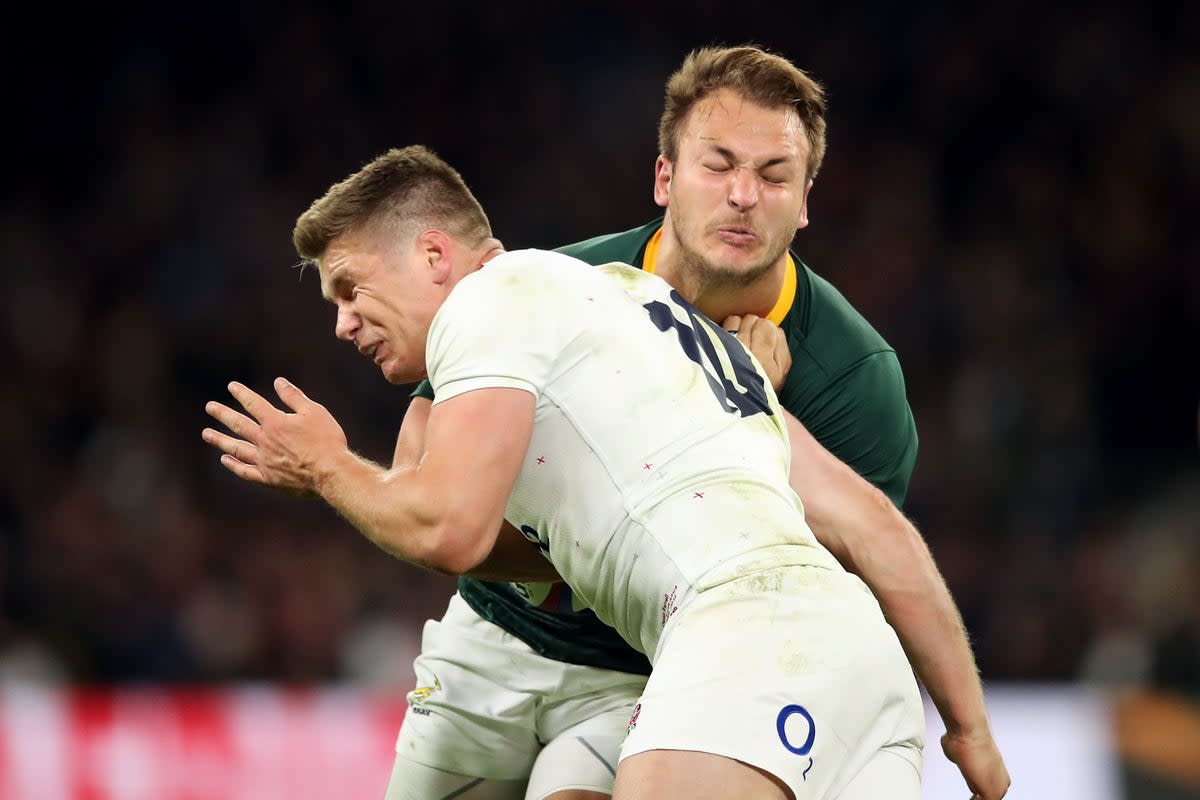 Owen Farrell tackles South Africa’s Andre Esterhuizen (Adam Davy/PA) (PA Archive)