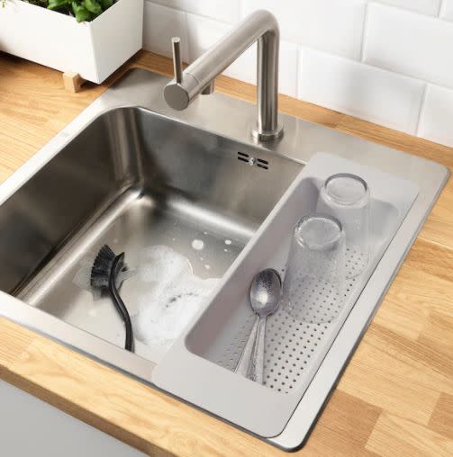 Free up space on your countertop with <a href="https://fave.co/3n8G7GH" target="_blank" rel="noopener noreferrer">this colander and drying rack</a> that nests perfectly into your sink. Just be sure to measure and make sure it'll fit. Find it for $6 at <a href="https://fave.co/3n8G7GH" target="_blank" rel="noopener noreferrer">IKEA</a>.