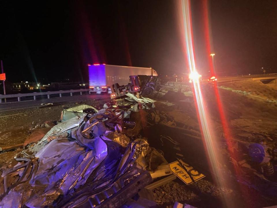 A semi carrying crushed cars flipped on Highway 395, spilling its load across the side of the road. Courtesy Kennewick Police Department