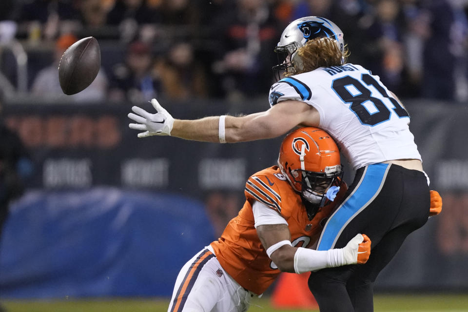 Carolina Panthers tight end Hayden Hurst (81) reaches for the ball but cannot make the catch as he is tackled by Chicago Bears safety Jaquan Brisker (9) during the second half of an NFL football game Thursday, Nov. 9, 2023, in Chicago. (AP Photo/Charles Rex Arbogast)