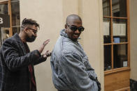 Kanye West attends the Kenzo fall-winter 22/23 men's collection, in Paris, Sunday, Jan. 23, 2022. (AP Photo/Lewis Joly)