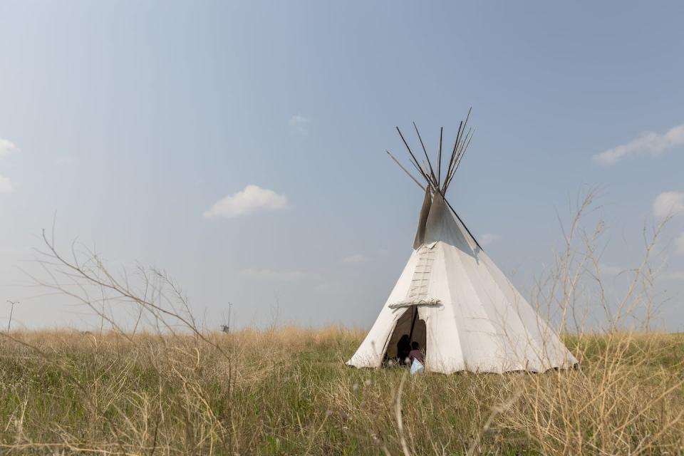 A tipi on the Land of Dreams site. Indigenous communities have long histories of stewarding the land and living reciprocally with the soil. (University of Calgary/Fritz Tolentino)