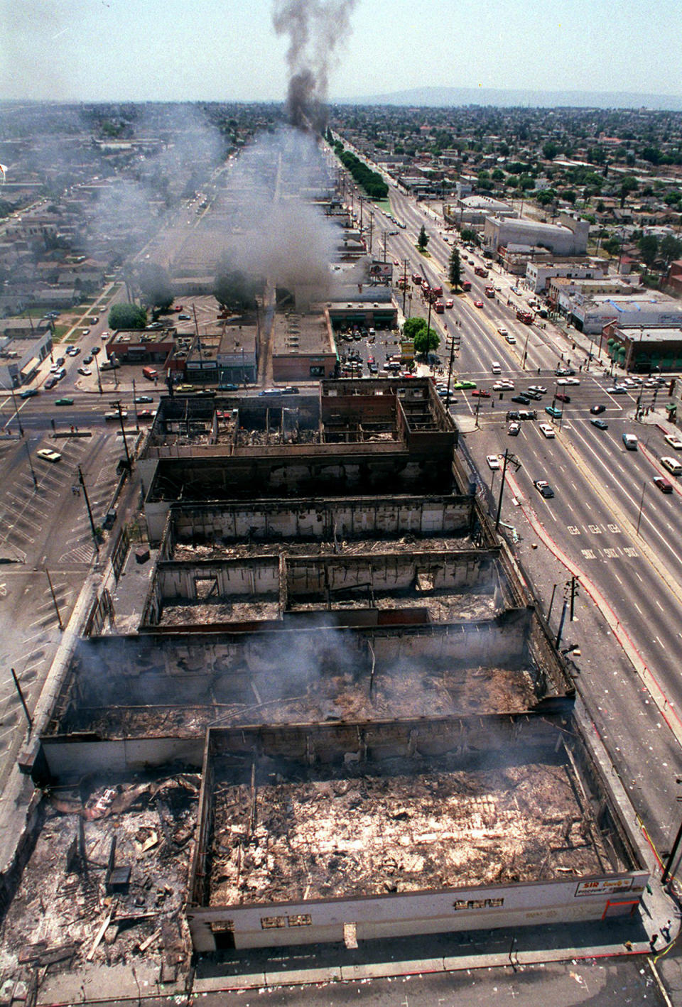 Smoke rising over burned out buildings