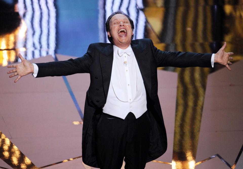 Billy Crystal: Crystal is credited with reinventing the role of Oscars host during his four-year run from 1990 to 1993. A more high-energy personality than most of his predecessors, the When Harry Met Sally... star proved himself a versatile awards show entertainer, and would return again five times over the years. He was comfortable with showmanship, not to mention self-promotion: at the 1991 awards, to promote City Slickers, he closed the ceremony by riding offstage on a horse. Crystal’s most recent appearance as host came in 2012, when he was brought in as a steady hand on the tiller after James Franco and Anne Hathaway’s disastrous spell the year previously. (Getty Images)