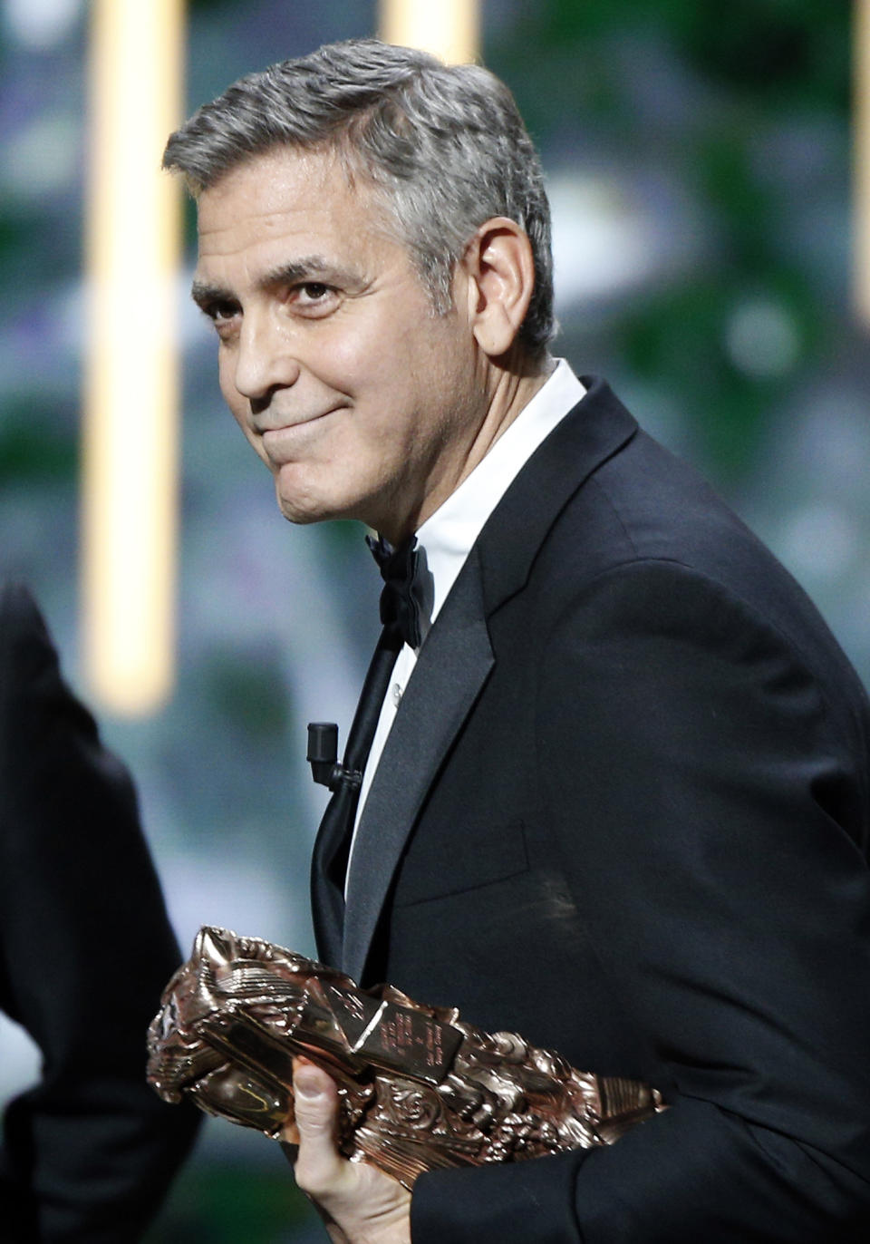 Actor George Clooney reacts on stage as he received an Honorary Cesar award during the 42nd Cesar Film Awards ceremony at Salle Pleyel in Paris, Friday, Feb. 24, 2017. This annual ceremony is presented by the French Academy of Cinema Arts and Techniques. (AP Photo/Thibault Camus)