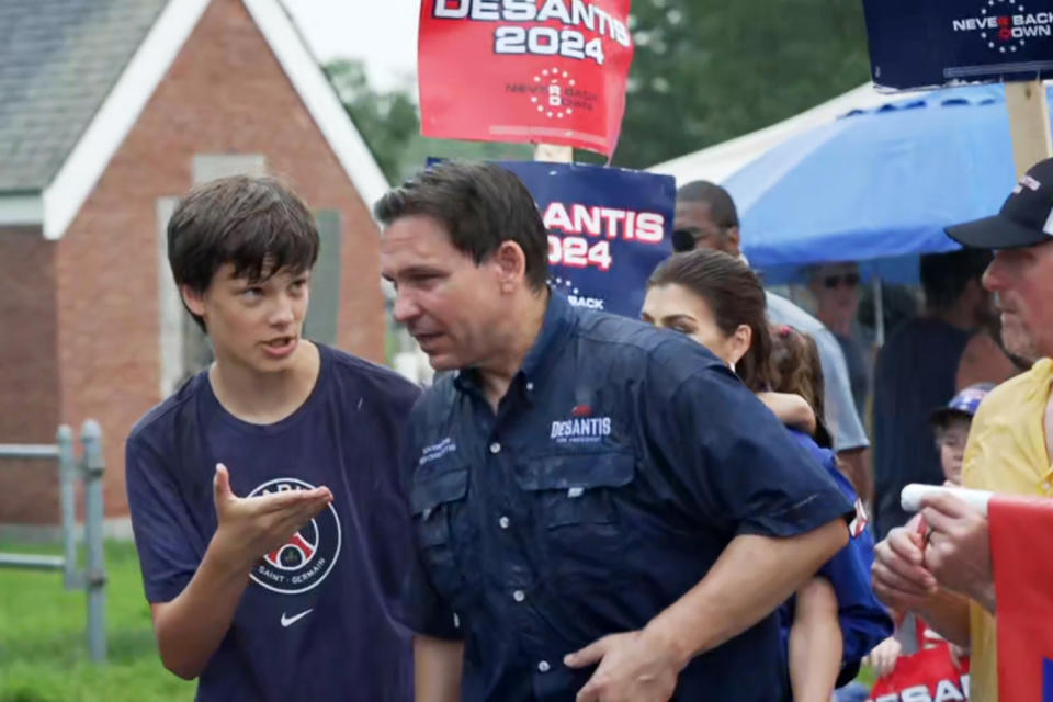 Quinn Mitchell with Ron DeSantis at a Fourth of July parade in Merrimack, N.H.  (Emma Barnett / NBC News)