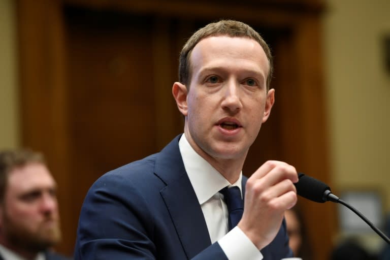 Facebook CEO and founder Mark Zuckerberg defends his company's business model to the US House Committee on Energy and Commerce