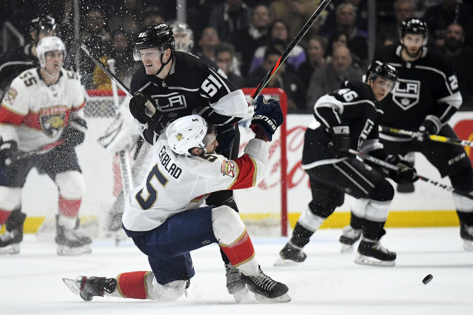 Los Angeles Kings left wing Austin Wagner, top, collides with Florida Panthers defenseman Aaron Ekblad during the second period of an NHL hockey game Thursday, Feb. 20, 2020, in Los Angeles. (AP Photo/Mark J. Terrill)