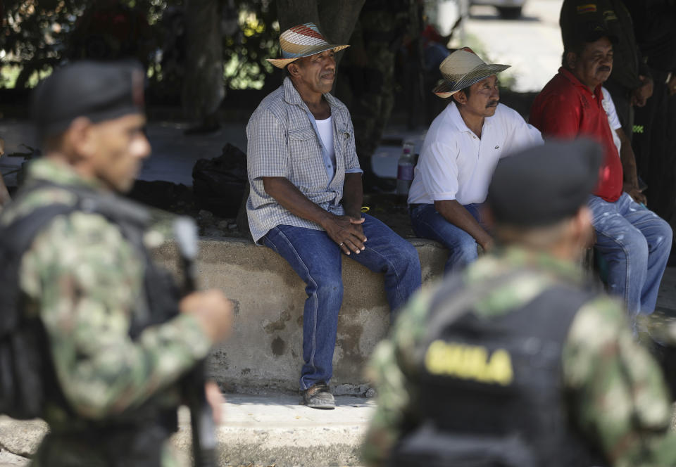 Neighbors of Luis Manuel Díaz wait for his arrival to his hometown of Barrancas, Colombia, after he was released by his kidnappers, Thursday, Nov. 9, 2023. Díaz, the father of Liverpool striker Luis Díaz, was kidnapped on Oct. 28 by the guerrilla group National Liberation Army, or ELN. (AP Photo/Ivan Valencia)