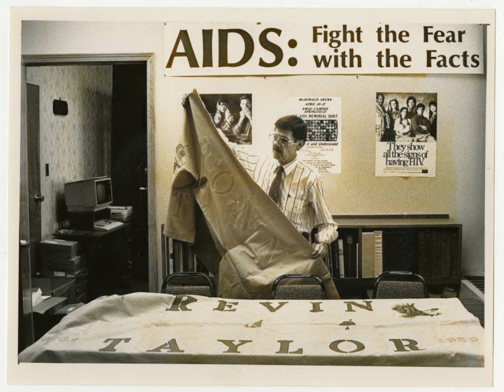 Gary Hoggard, the director of AIDS Project of the Ozarks, displaying two quilts that were featured as part of "The Names Project" in April 1991. The photo appeared in a story published in the News-Leader on March 29, 1991.