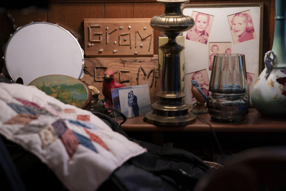 Knickknacks and keepsakes are displayed in the home of Nancy Rose and her mother, Amy Russell, Tuesday, Jan. 25, 2022, in Port Jefferson, N.Y. They both contracted COVID-19 in 2021. (AP Photo/John Minchillo)